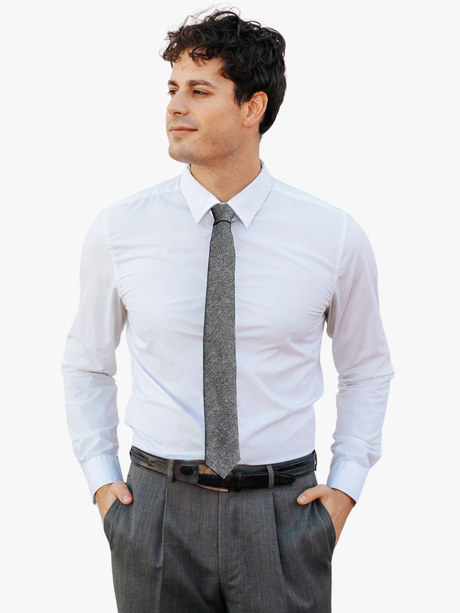 A man wearing a herringbone tie with alternating white and black zigzag designs on a soft cotton fabric.