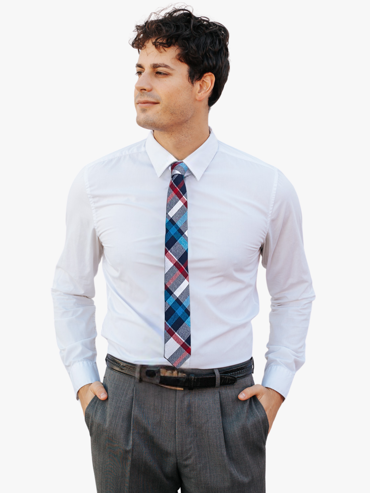 A man wearing a plaid tie with white fabric, thin red lines, turquoise bars, and colorful design.