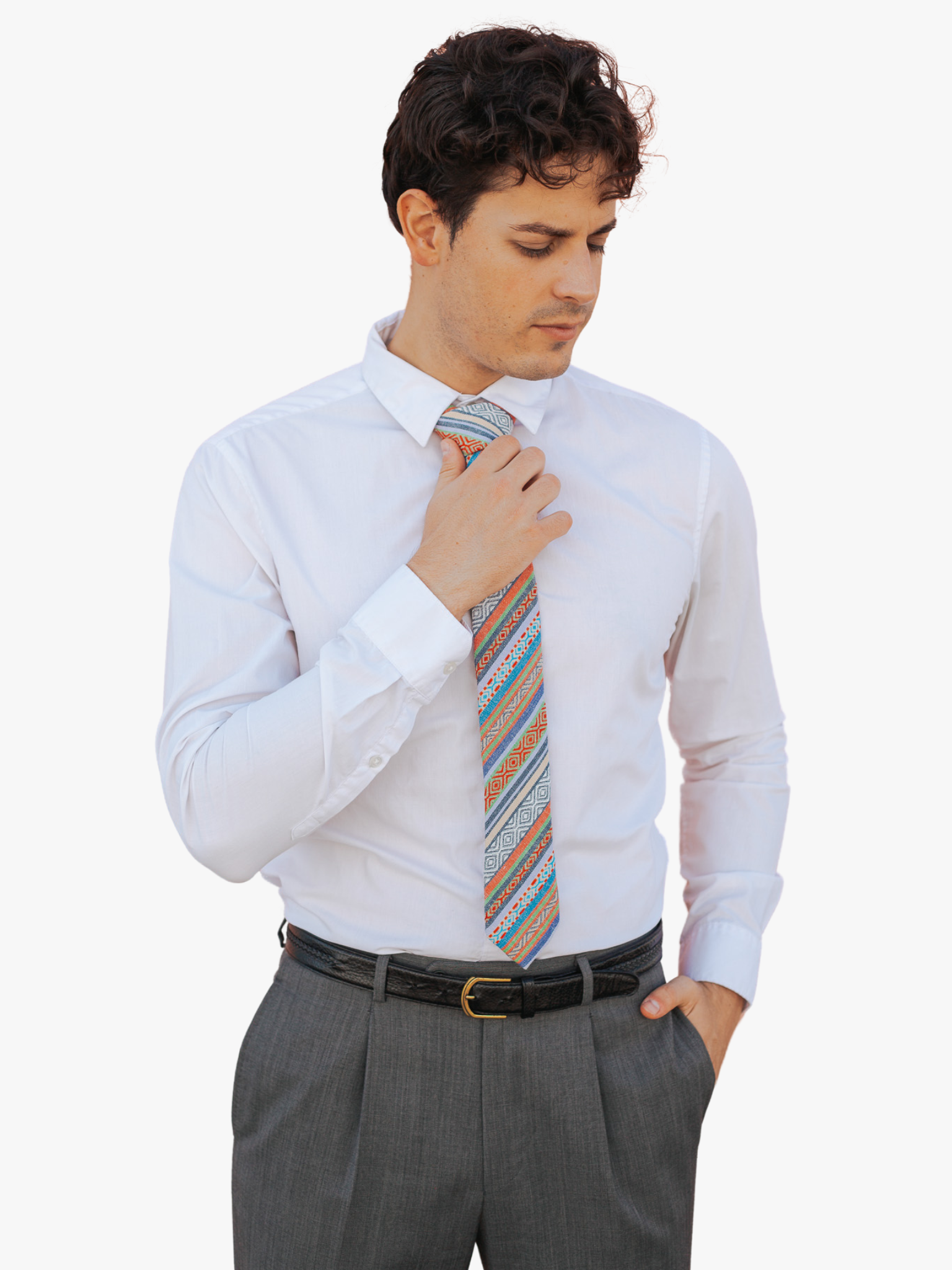 A man wearing church clothes and a striped tie with red stripe, green lines, blue bars, zig zag designs.