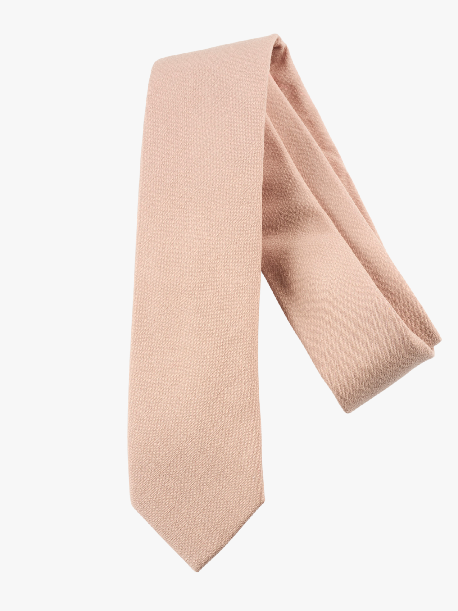 A folded solid pure cotton adult men's necktie with plain neutral pink taupe color.