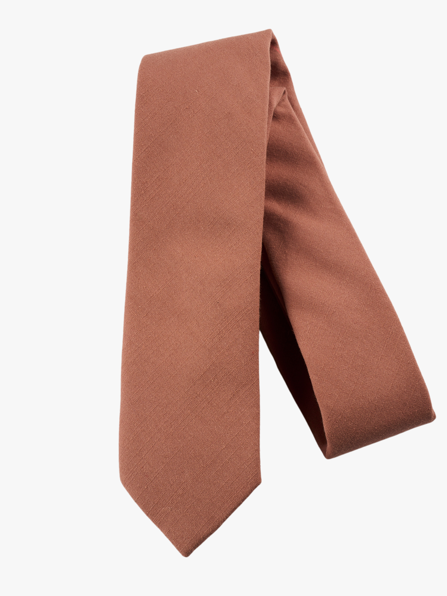 A folded solid woven cotton men's necktie with a simple rosewood rosegold light pink color.