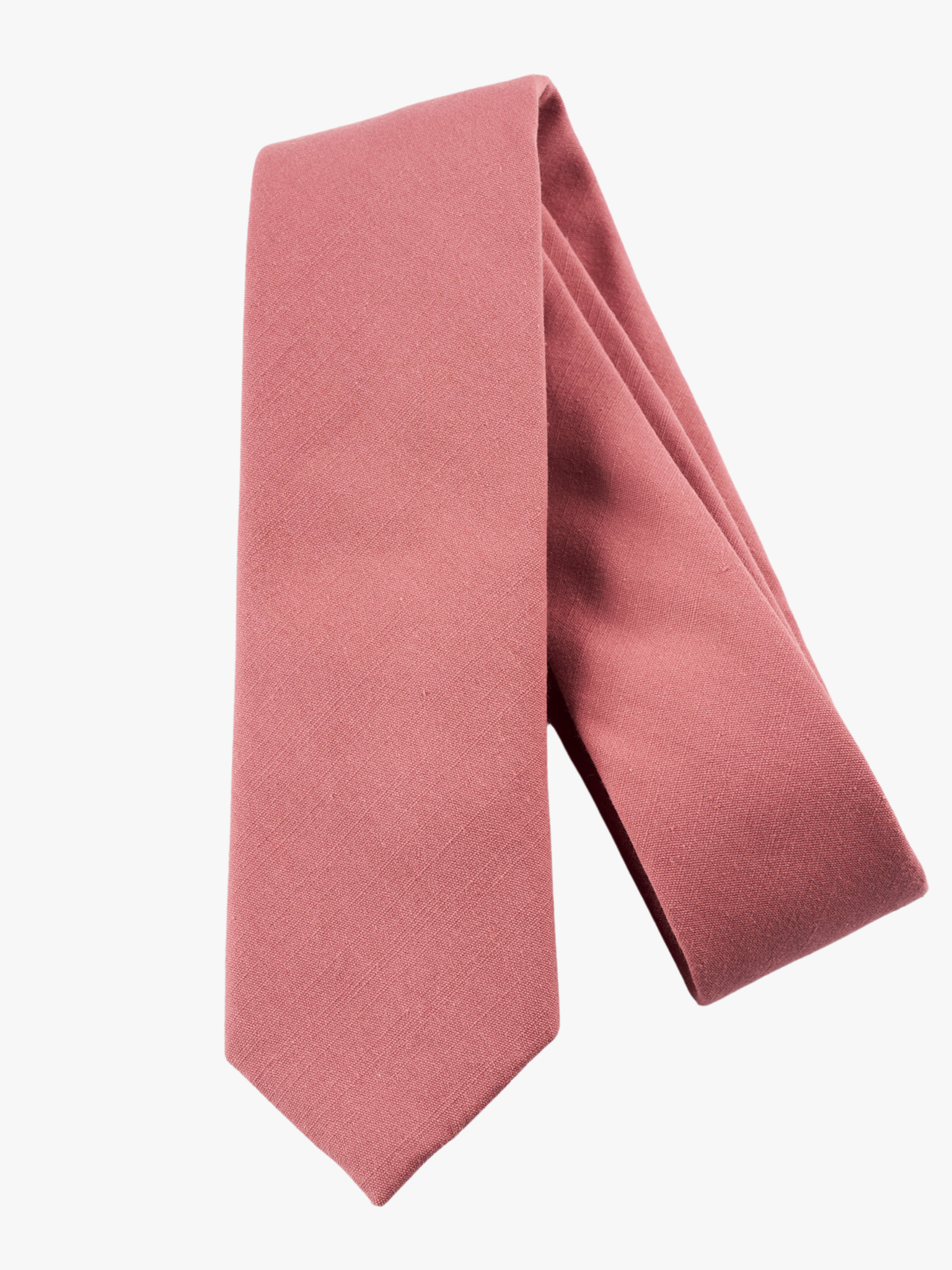 A folded solid pure cotton adult men's necktie with plain darker rose-gold dusty pink color.