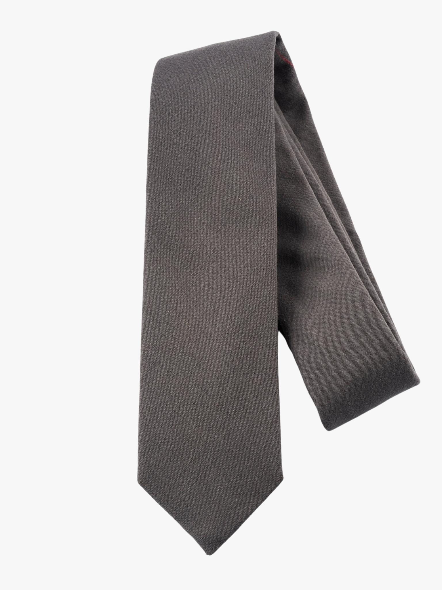 A folded solid pure cotton adult men's necktie with plain dark gray/grey color.