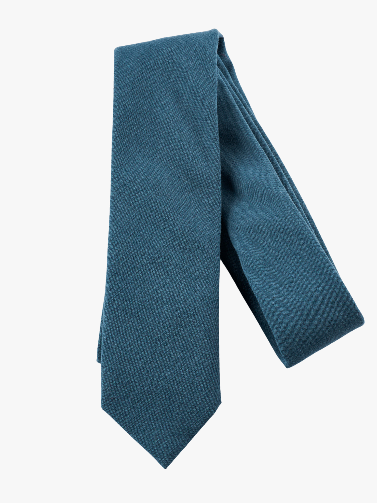 A folded solid woven cotton men's necktie with a simple deep cobalt blue color.