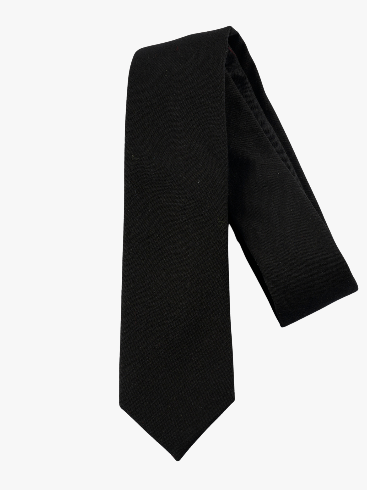 A folded solid woven cotton men's necktie with a simple pitch black color.