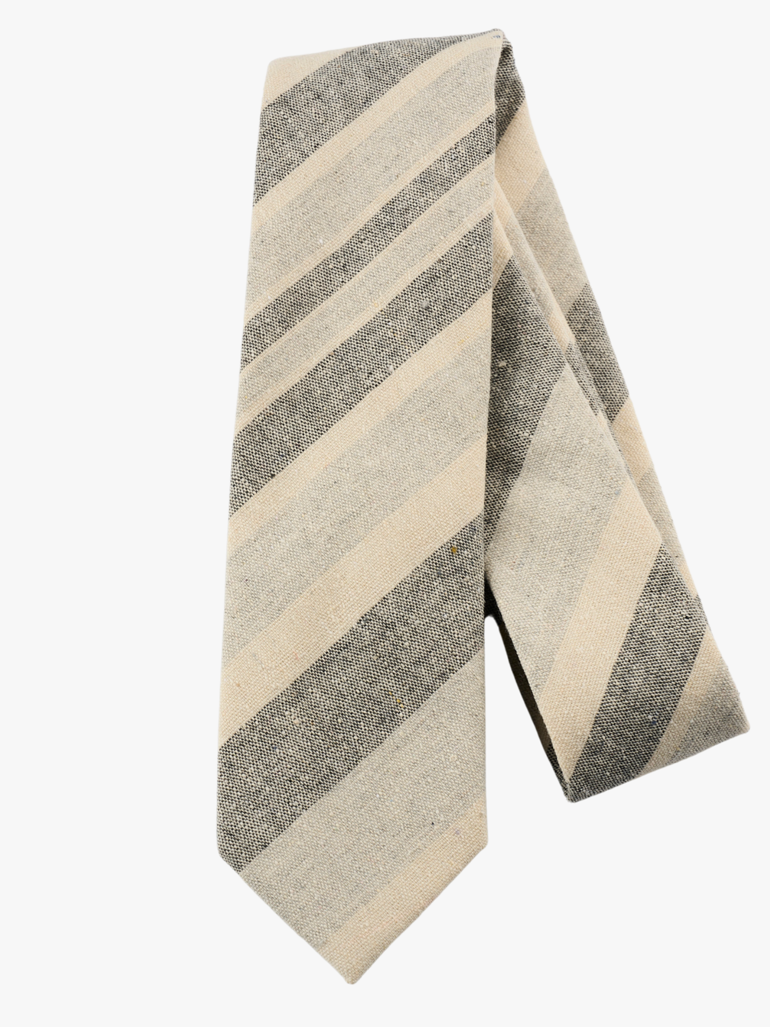 A folded pure cotton, striped adult men's necktie with pale grey stripes, dark gray lines, cream  bars and diagonal designs.