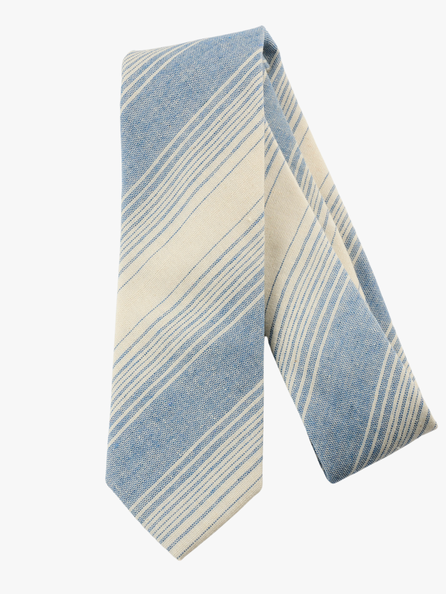 A folded striped adult men's necktie with light dusty blue stripes, thin beige cream lines,  and off-white diagonal designs.