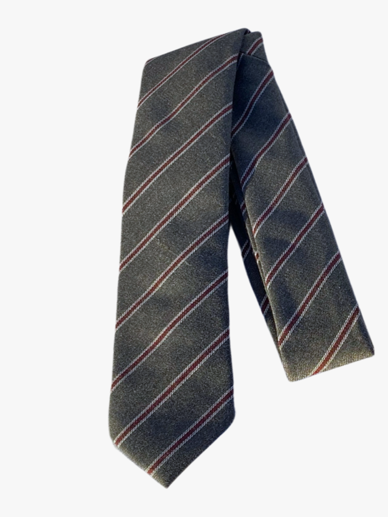 A folded striped adult men's necktie with a silky grey fabric and thin repeating lines of white and crimson red.