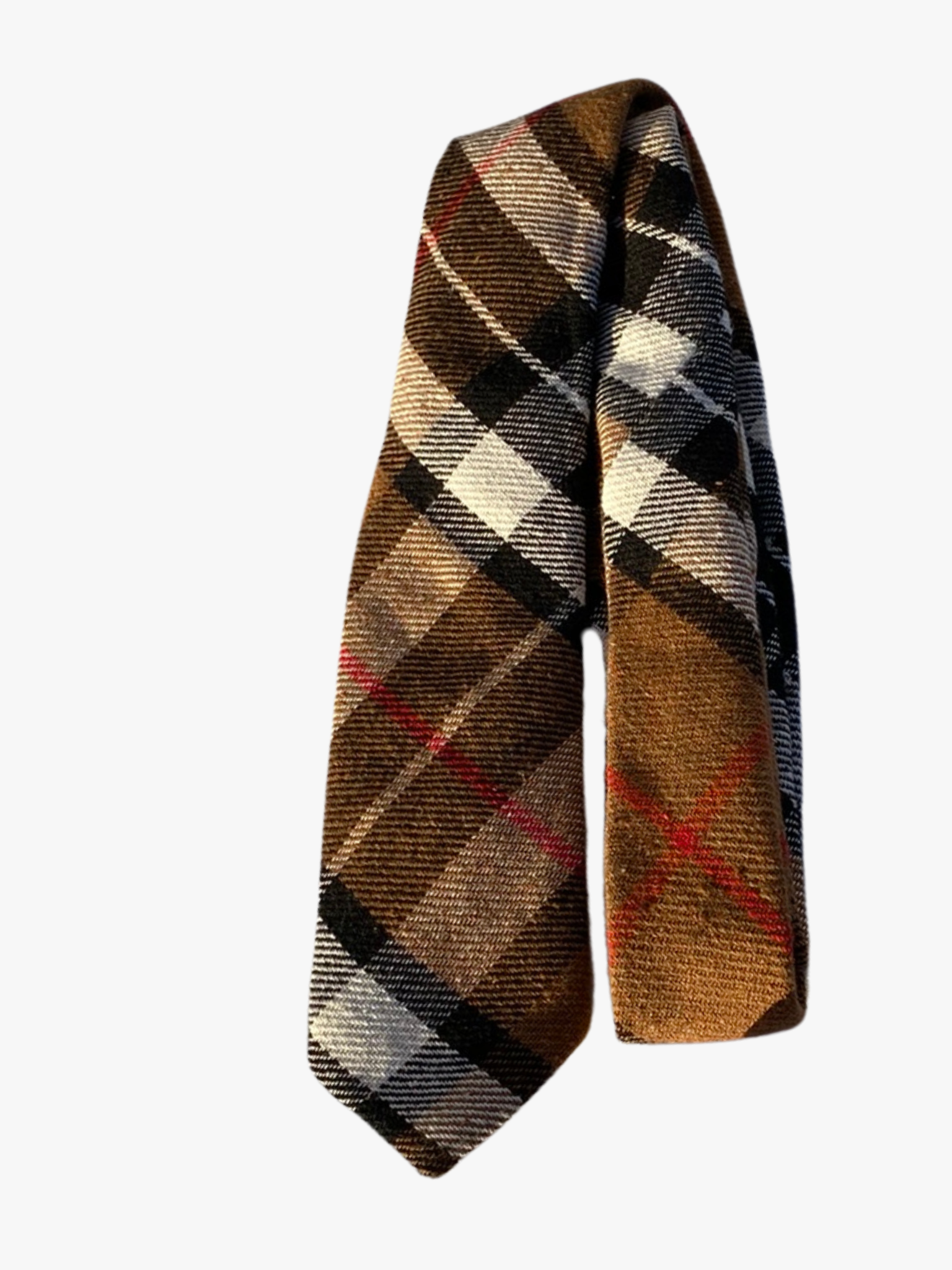 A folded retro plaid adult men's necktie with brown fabric, black bars, white accents, and thin red lines.