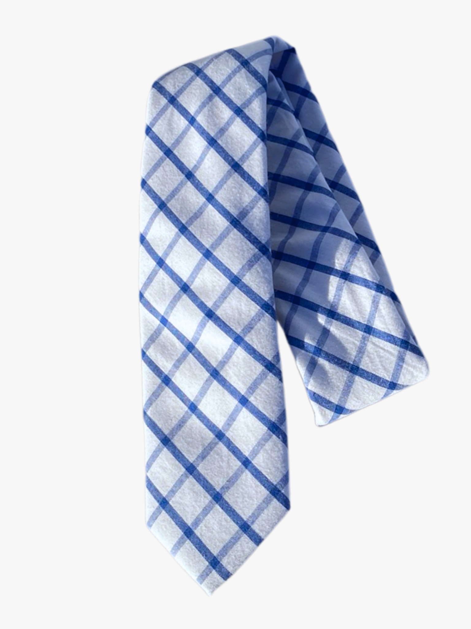 A folded plaid adult men's necktie with a pure white fabric covered in intersecting lines of navy and light blue.