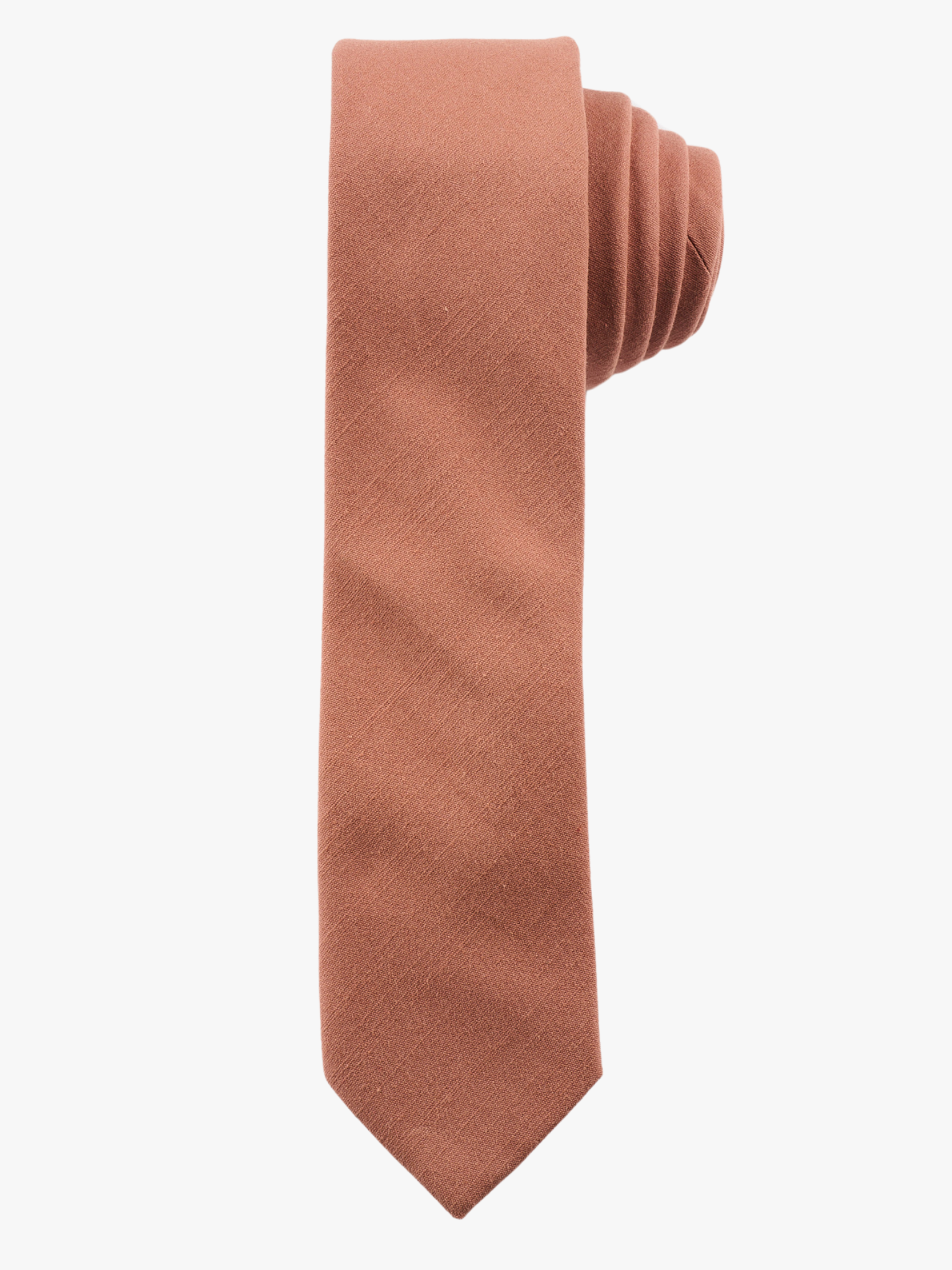 A rolled up rosewood light pink solid-colored cotton necktie for teens, missionaries, men, and women.