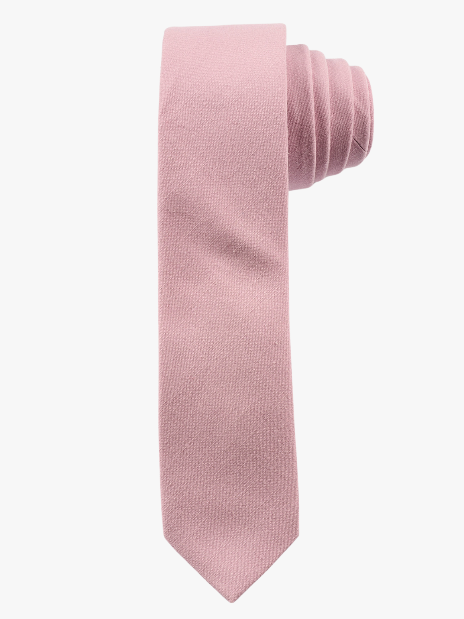 A rolled up  light rose dusty pink solid-colored cotton necktie for teens, missionaries, men, and women.