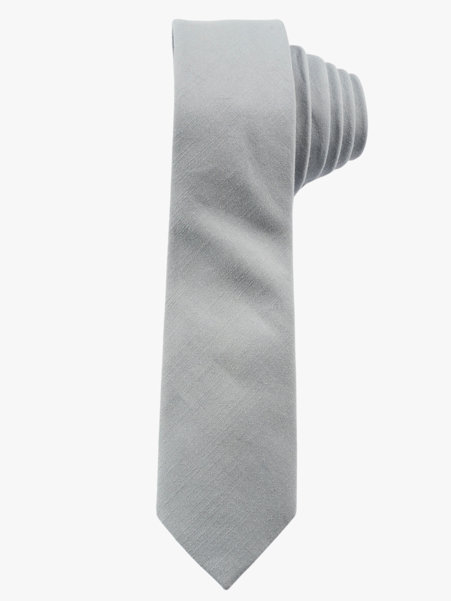 A rolled up pale blue/gray solid-colored cotton necktie for teens, missionaries, men, and women.