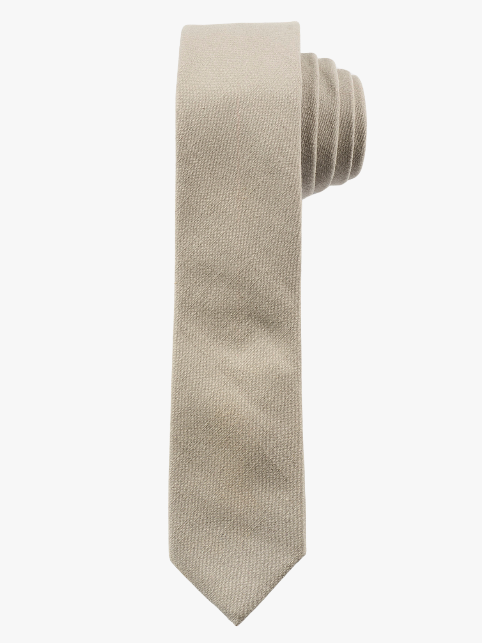 A rolled up light sandy tansolid-colored cotton necktie for teens, missionaries, men, and women.