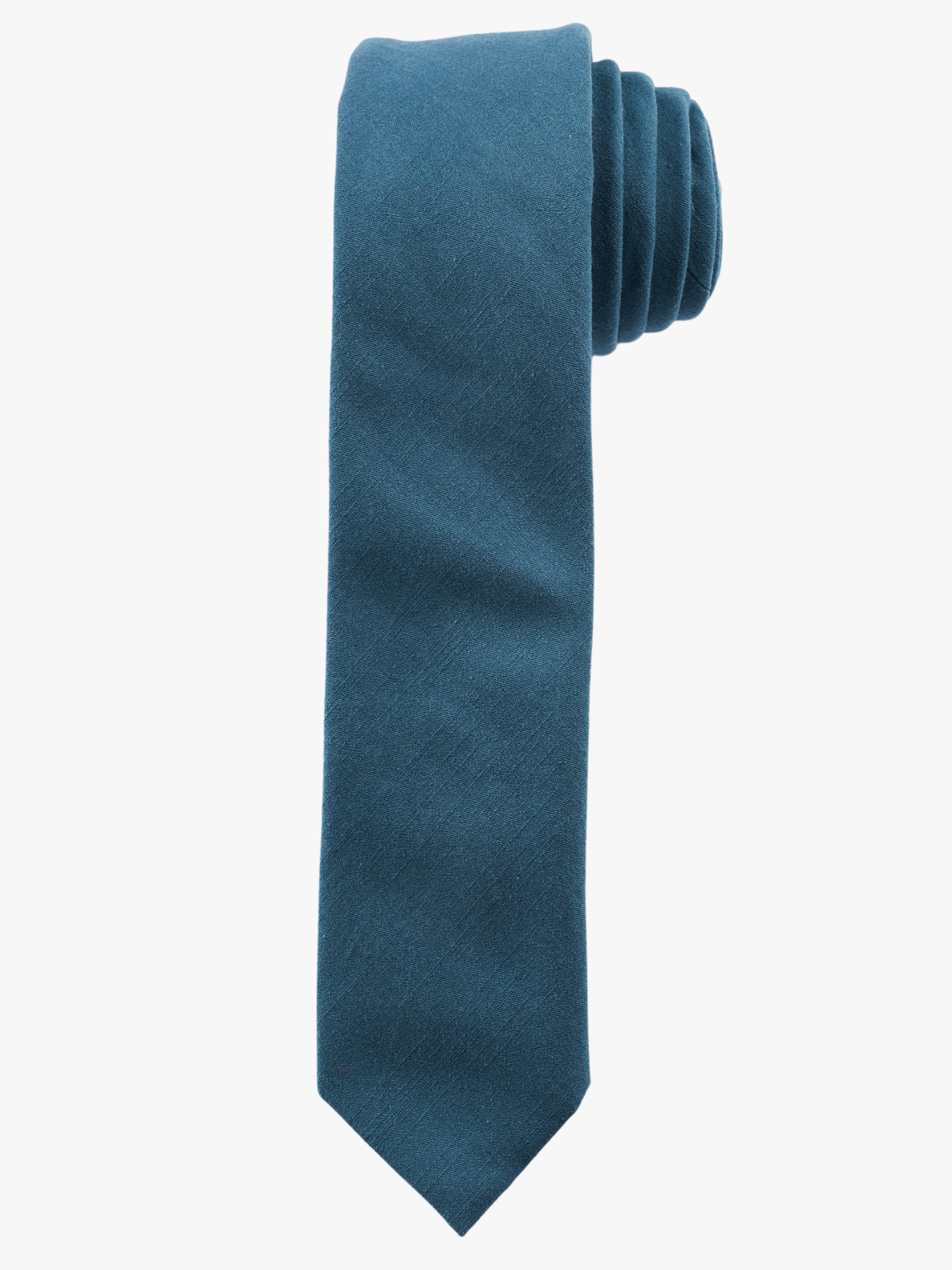 A rolled up deep cobalt blue solid-colored cotton necktie for teens, missionaries, men, and women.