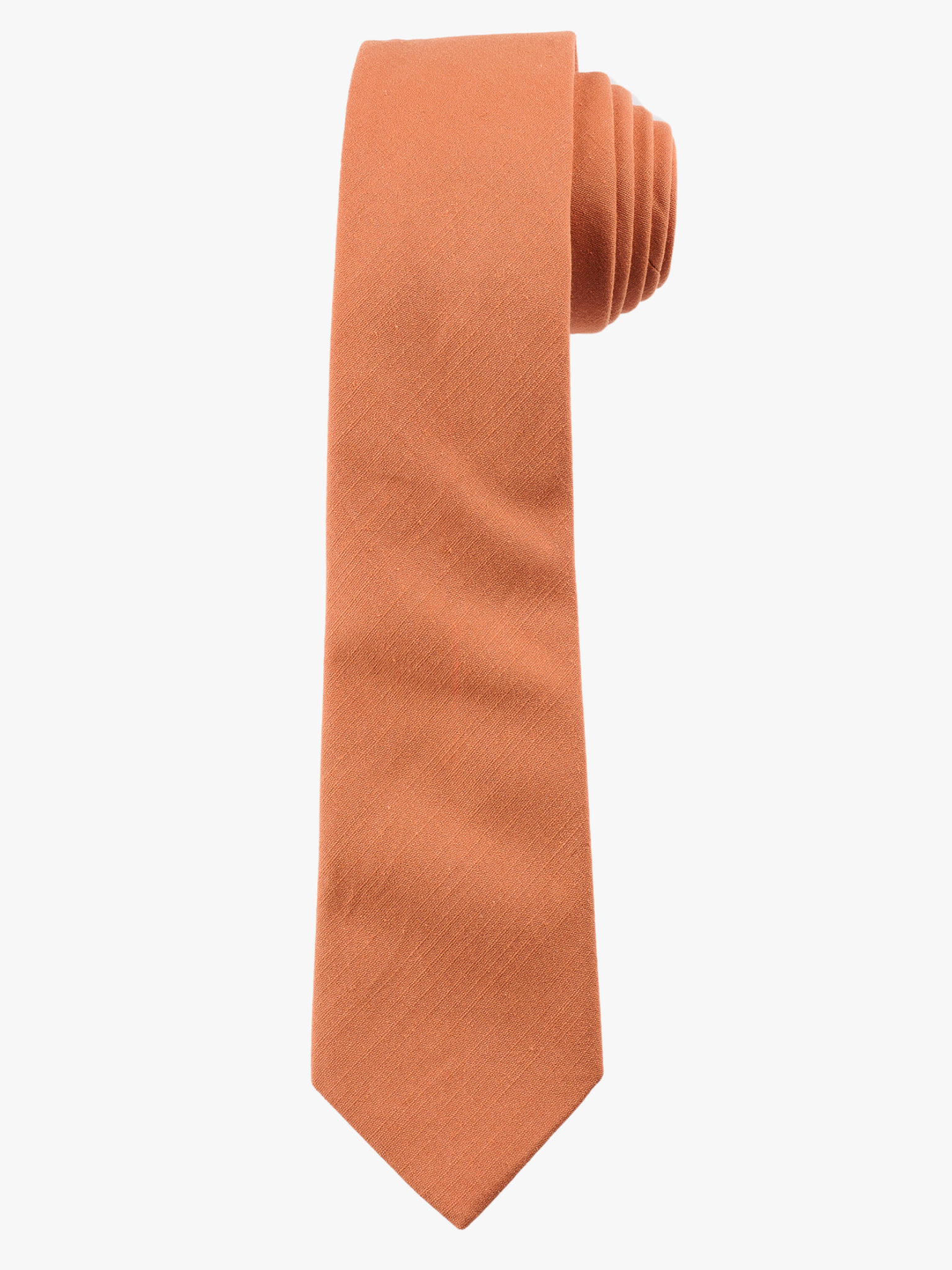 A rolled up burnt orange salmon solid-colored cotton necktie for teens, missionaries, men, and women.