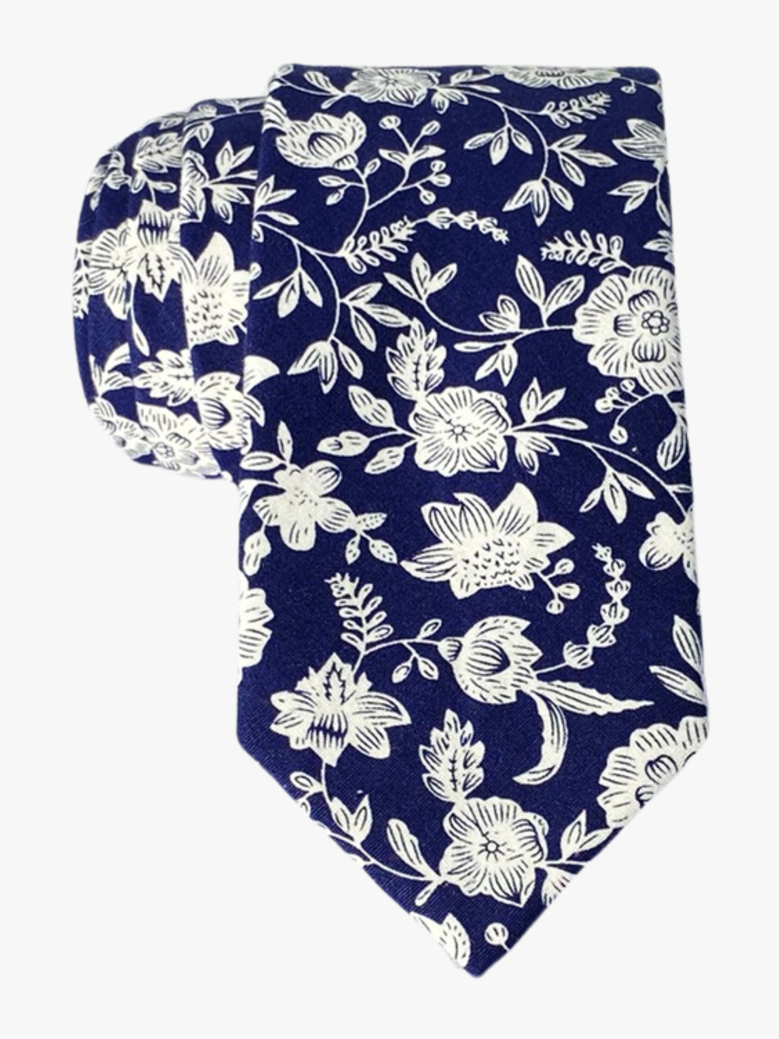 A mens navy blue cotton floral tie with white flowers and vines remenisicent of fine china, delftware, or talevera pottery.