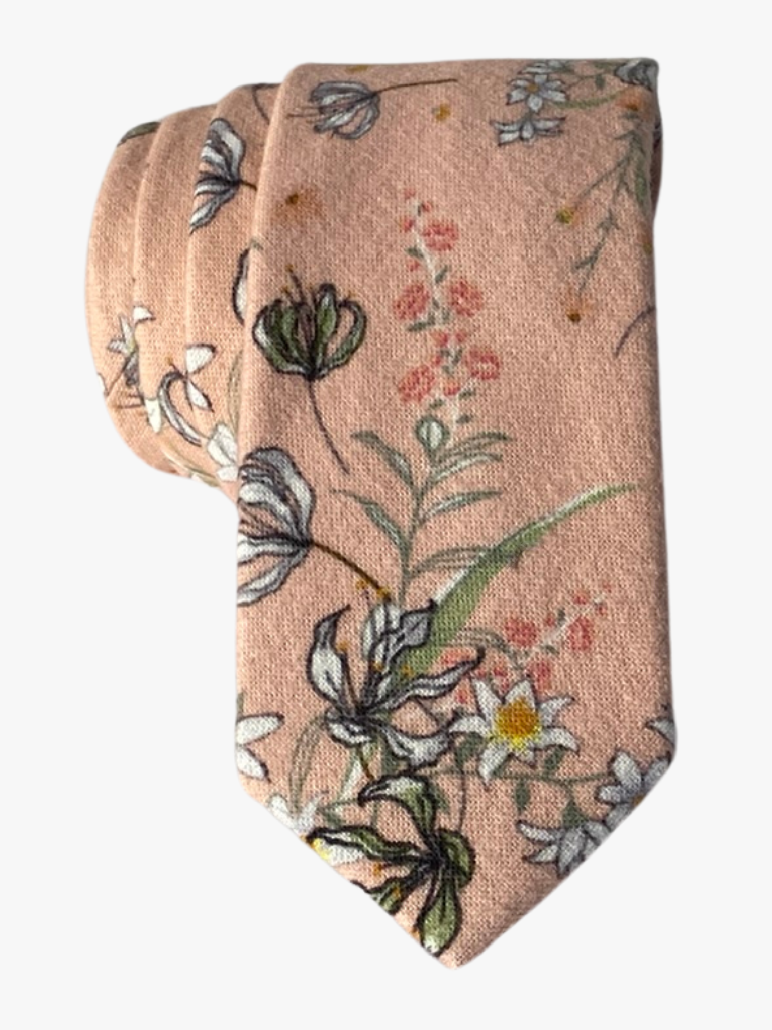 An adult peach colored cotton necktie with white and yellow flowers outlined in black, small pink flowers, and green leaves.