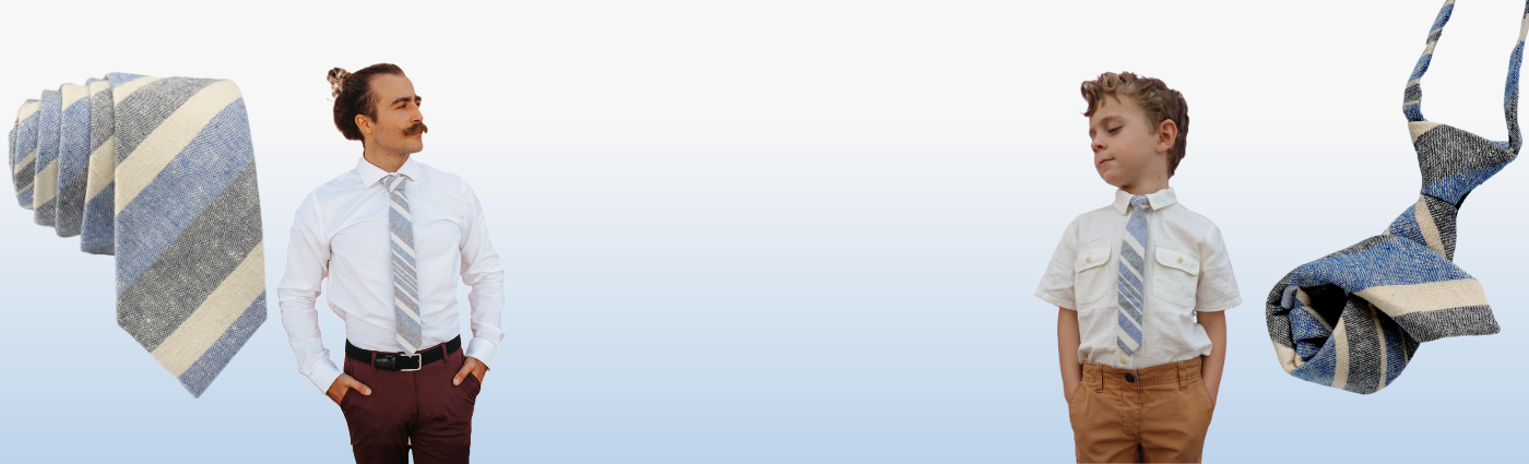 A man and boy in matching blue striped ties standing in front of a blue background. 