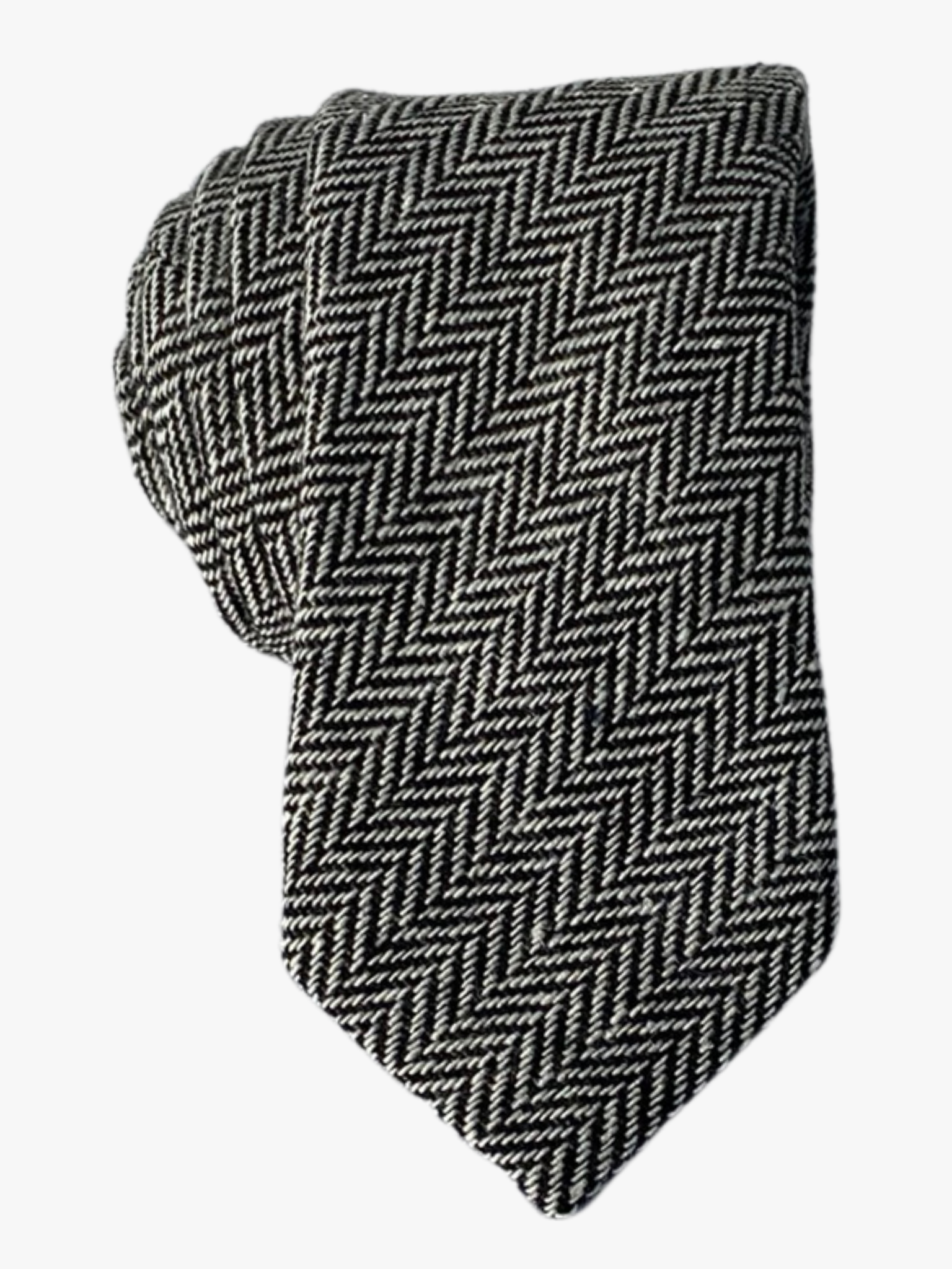 Adult mens herringbone tie with black and white arrow designs and an infinite repeating diagonal pattern for missionaries.