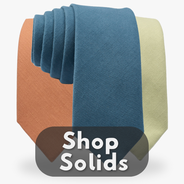 A button displaying 3 solid colored cotton neckties of blue, orange, and green.